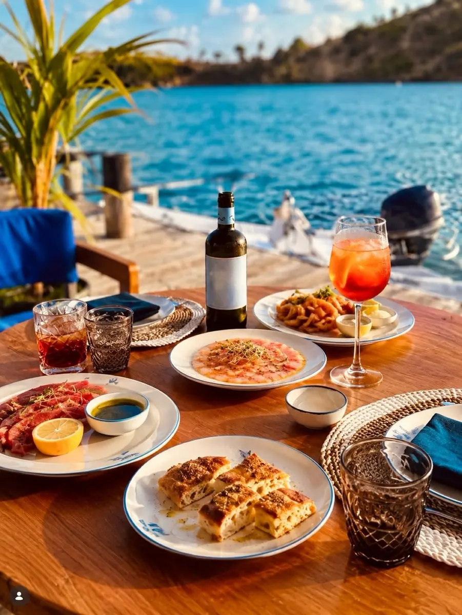 Sunset table with wine, carpaccio and focaccia